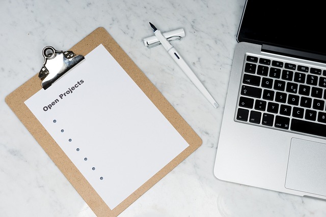 open laptop with article content and notes