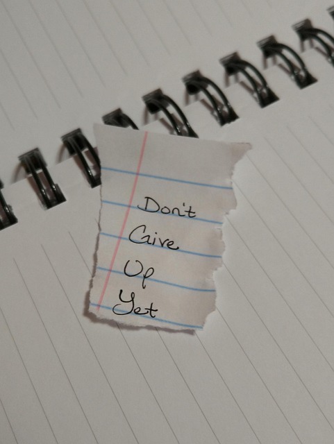 person writing negotiation notes